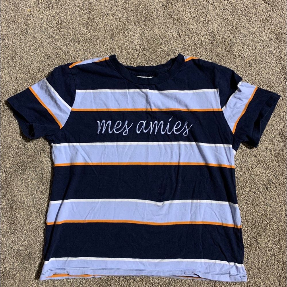 blue, orange, light blue striped shirt “mes amies”